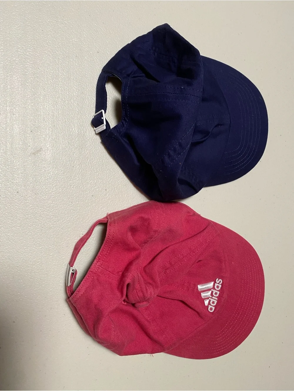 NWOT 2 for 19 NWOT Adidas pink & Under Armour navy logo baseball caps - set of 2